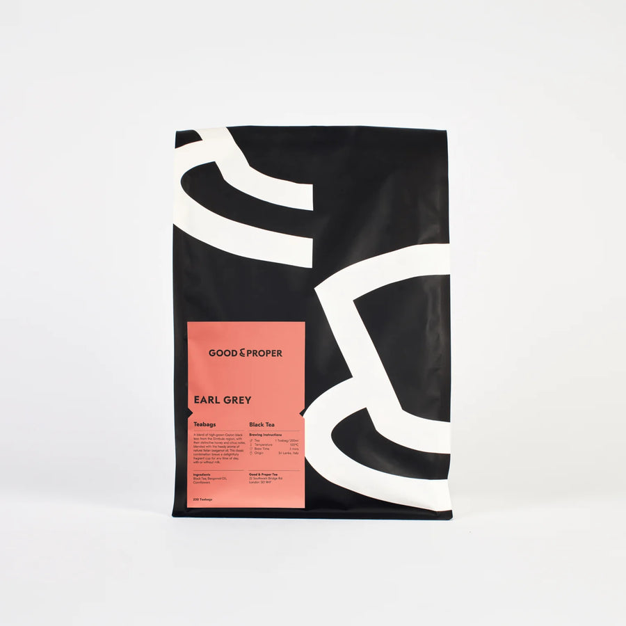 A packaged bag of Good & Proper Earl Grey 250 tea bags with a minimalist design, featuring black and pink colors.