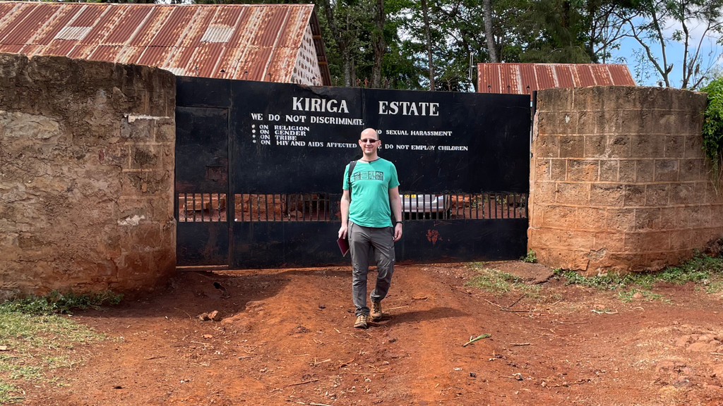 OCR Green Buyer Roland Glew at the main gates to the Kiriga Estate