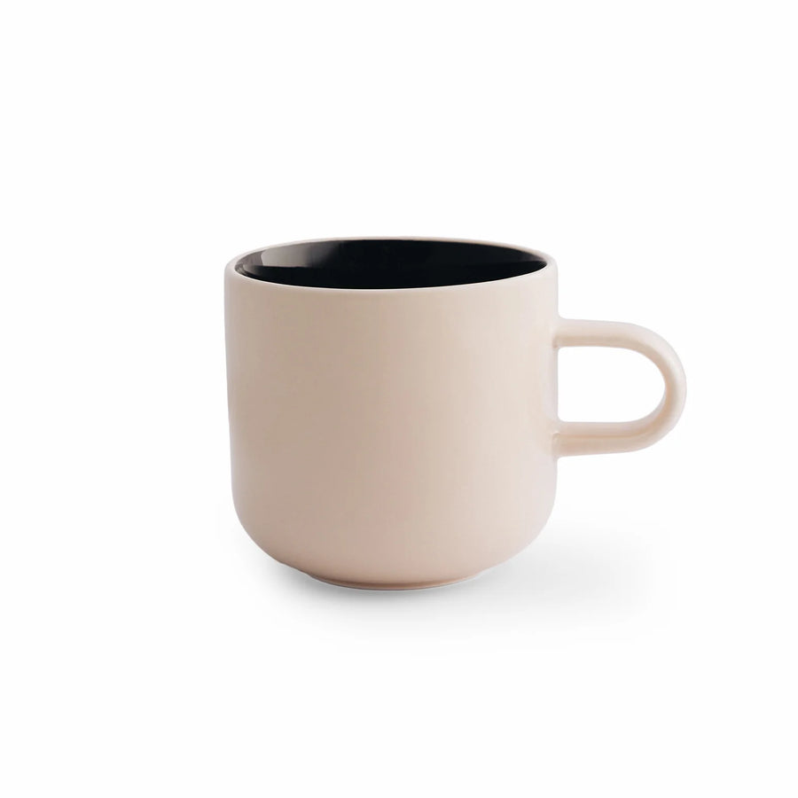 Acme x Karen Walker Bobby Mug - Macadamia with Black: A stylish 300ml porcelain mug displayed on a white surface, highlighting its unique design collaboration and elegant color palette.