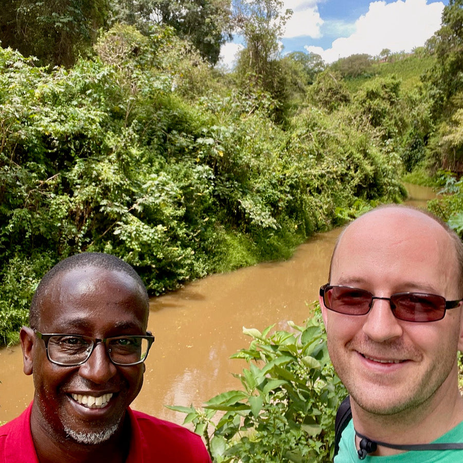 Dr. Brian Gakunga and Ozone Green Buyer Roland Glew near the Chania River on the Kiriga Estate in Muranga, Kenya