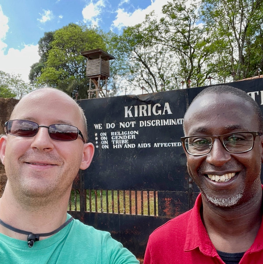 Ozone Green Buyer Roland Glew and Dr. Brian Gakunga at the front gates of the Kiriga Estate in Muranga, Kenya