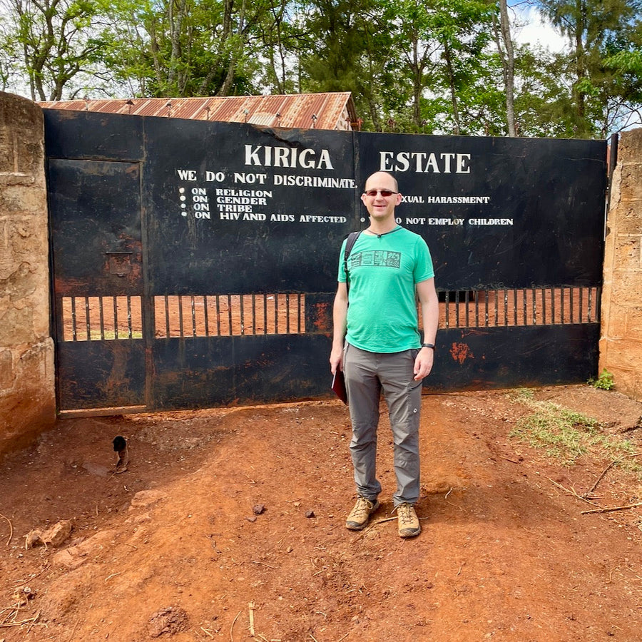 Ozone Green Buyer Roland Glew at the entrance gates to the Kiriga Estate in Muranga, Kenya