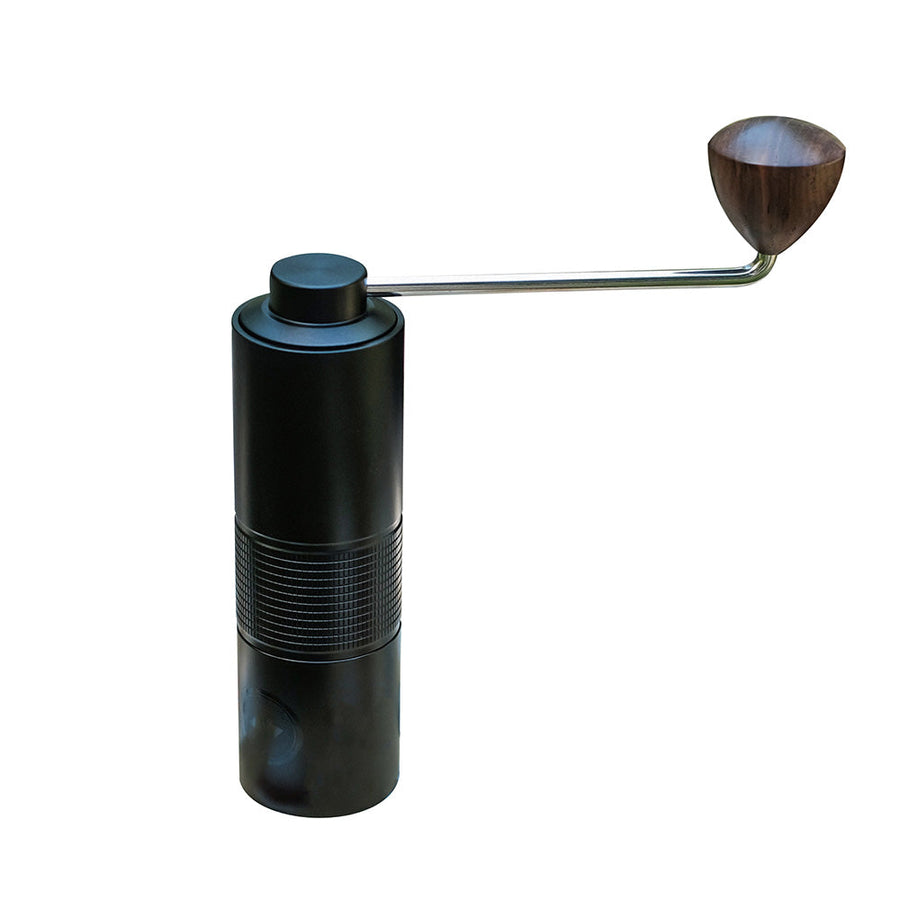 Modern black Hario Kabuto manual coffee grinder with ridged aluminium body, stainless steel burrs, and a long metal handle with wooden knob – ideal for consistent hand grinding.