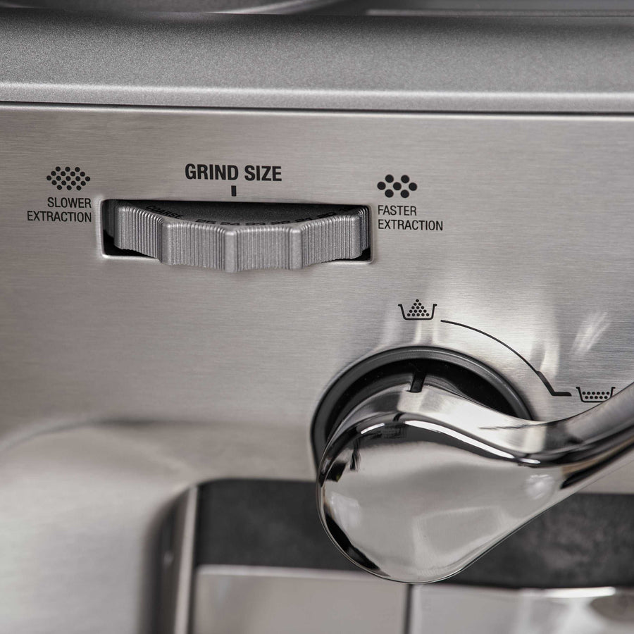 Close-up of Sage Barista Express™ Impress SES876 Home Espresso Machine's grind size adjustment dial with labels.