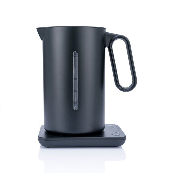 A black Wilfa fixed temperature control kettle on a stand, with a digital temperature readout on the front.