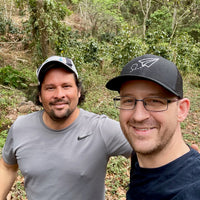 Miguel Girón and Ozone Green Buyer Roland Glew at La Alondra in Lepaterique, Honduras