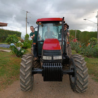 Hasbean eCommerce Manager Chris Glover-Price, Jose Ignacio Arrieta and OCR Green Buyer Roland Glew after a tractor ride together ending at the ARBAR micromill