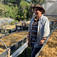 Carlos Arrieta shares a laugh with OCR Green Buyer Roland Glew amongst the raised drying beds at the ARBAR micromill