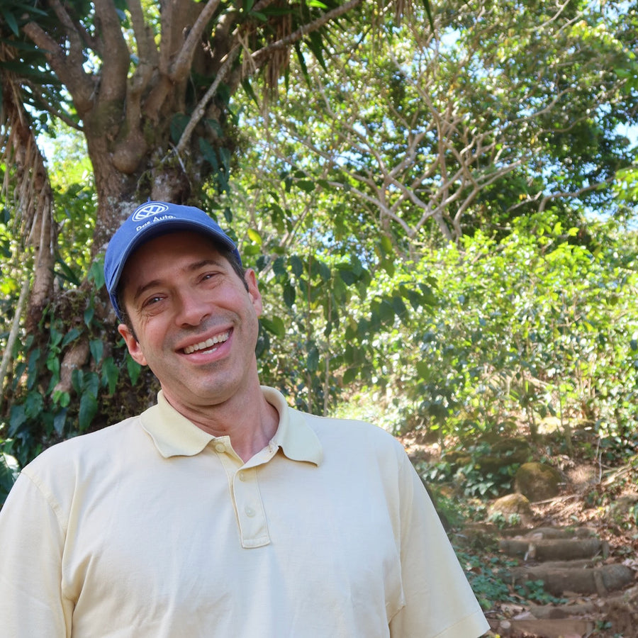 Alejandro Martinez smiling at Finca Argentina in Ahuachapán, El Salvador.