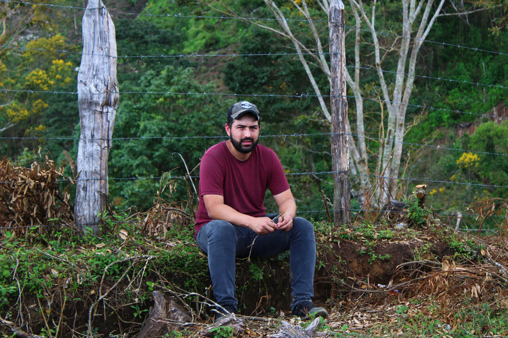 Benjamín Paz Muñoz sits and relaxes on his farm La Orquidea