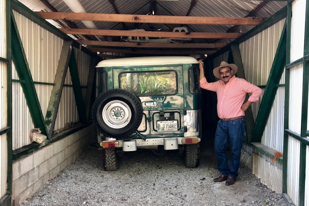 Beto with his favourite vehicle to drive around his farm in