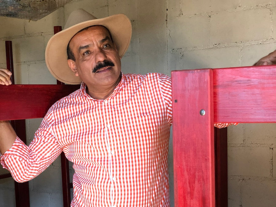Guadalupe 'Beto' Reyes amongst coffee drying beds at El Limon in Palencia, Guatemala