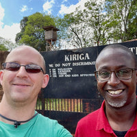 Ozone Green Buyer Roland Glew and Dr. Brian Gakunga at the front gates of the Kiriga Estate in Muranga, Kenya
