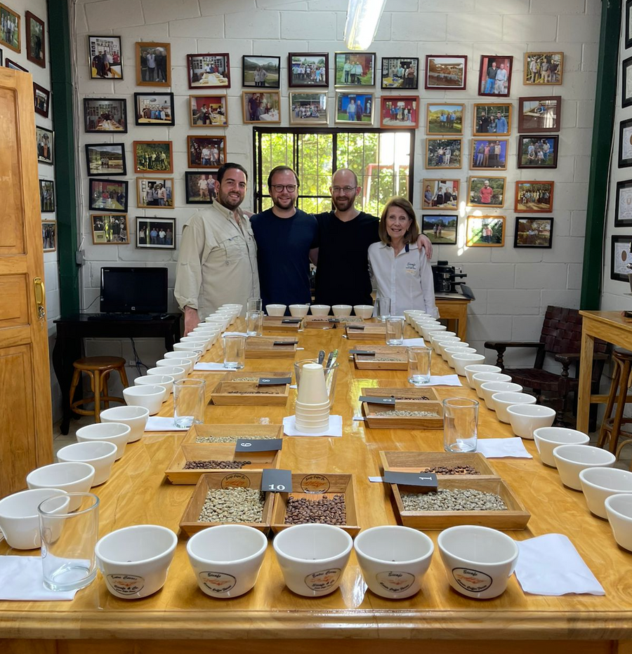 Ozone Green Buyer Roland Glew at the Sicafe cupping lab in Apaneca, El Salvador with Rafael Silva Jr, Ollie Futcher of Interamerican, and Carmen Silva.