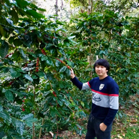 Watchara Yawirach with some of his coffee in Mae Chedi, Thailand