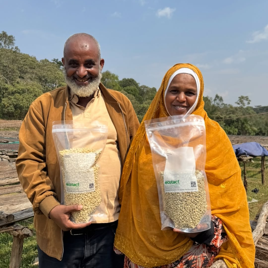 Mensur Aba Hika and his wife Nesru Aba Nura with bags of their processed coffee in Jimma, Ethiopia