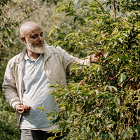 Mensur Abahika with his coffee in Jimma, Ethiopia