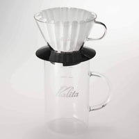 Kalita Jug Glass Server - Jug 500 (500ml) combination shot showing server with Kalita black glass brewer and 185 filter paper on top, ready to brew coffee